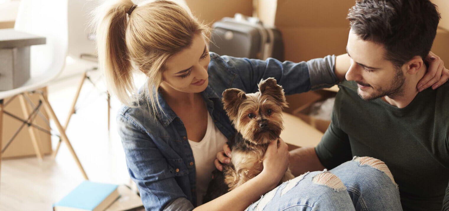 two people with a dog moving at smyrna ga apartments